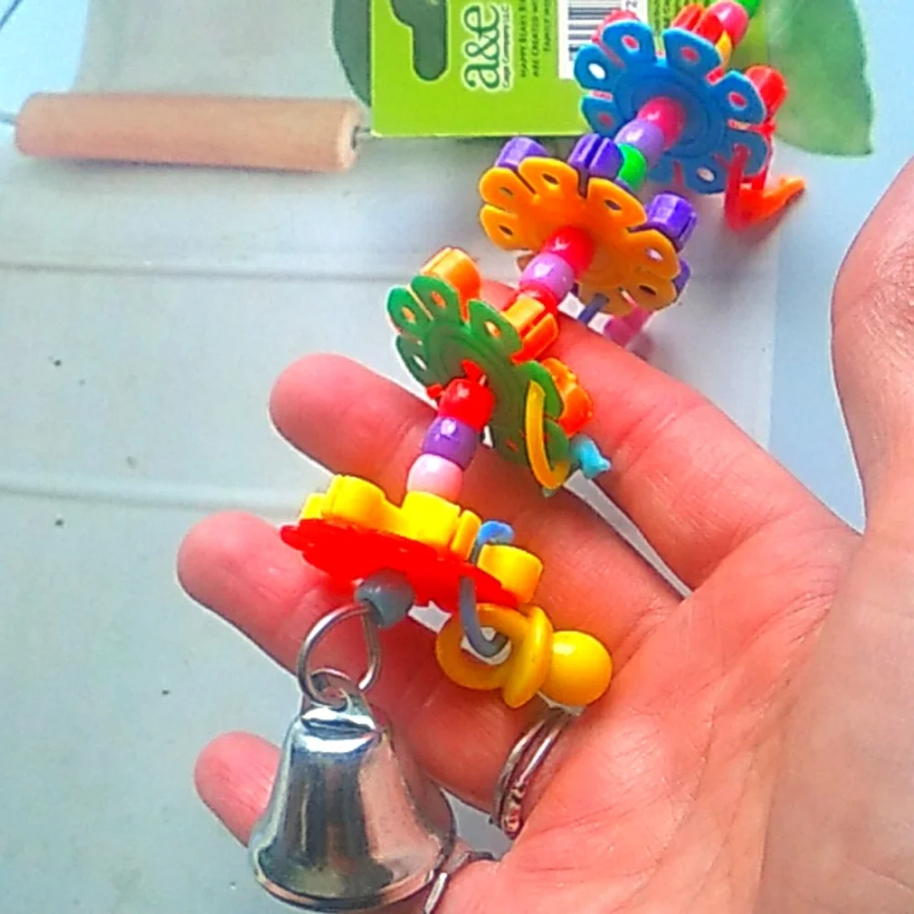 New in package Bird Toys colorful, has bells Beads and spinners